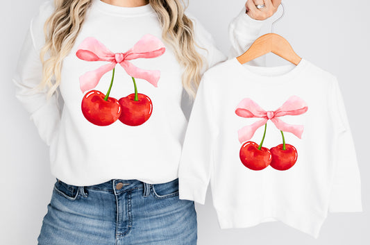 White sweatshirt with cherries and bow print