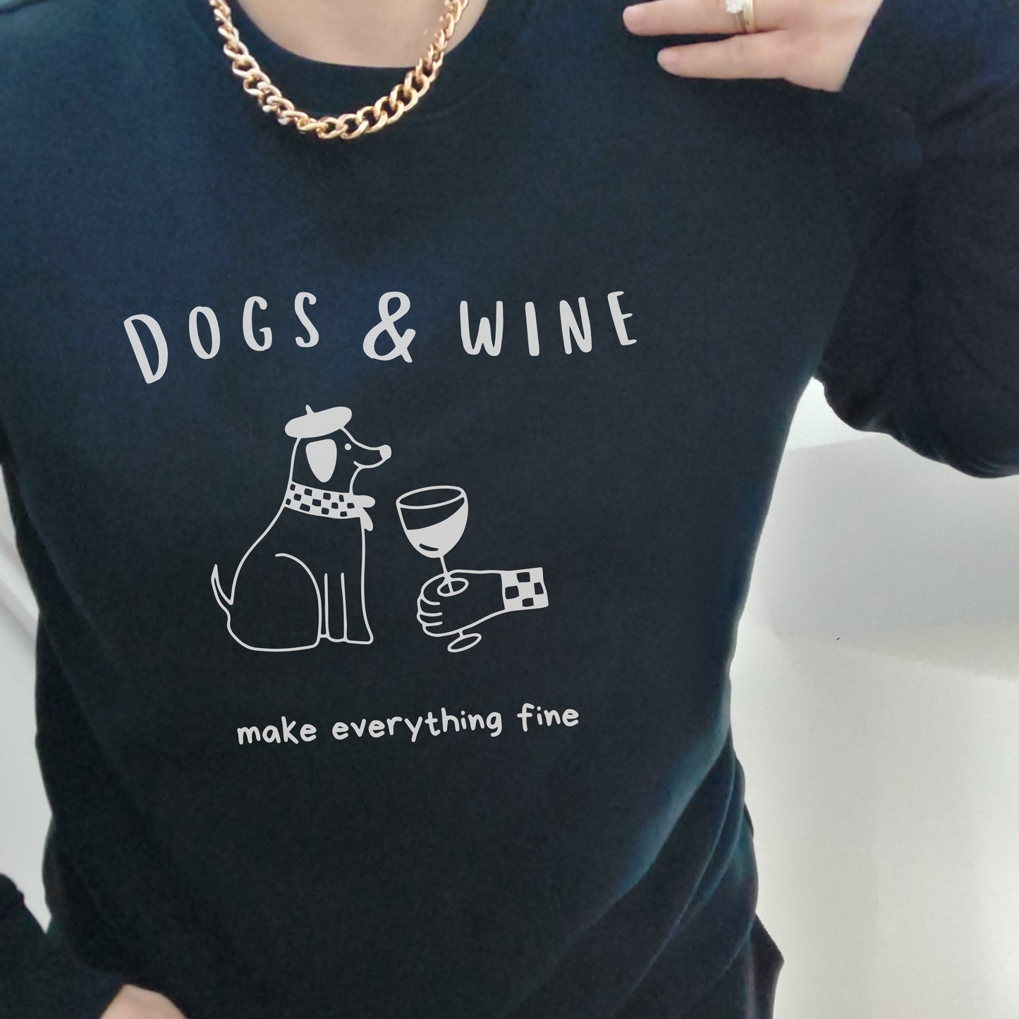 Black sweatshirt with 'DOGS & WINE make everything fine' text and graphic 